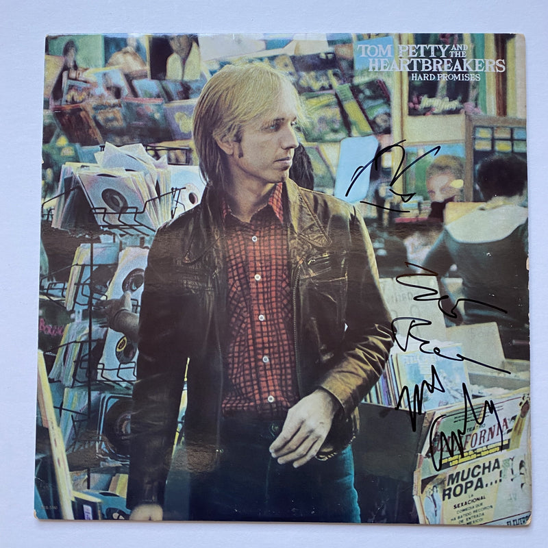 TOM PETTY and THE HEARTBREAKERS autographed "Hard Promises"