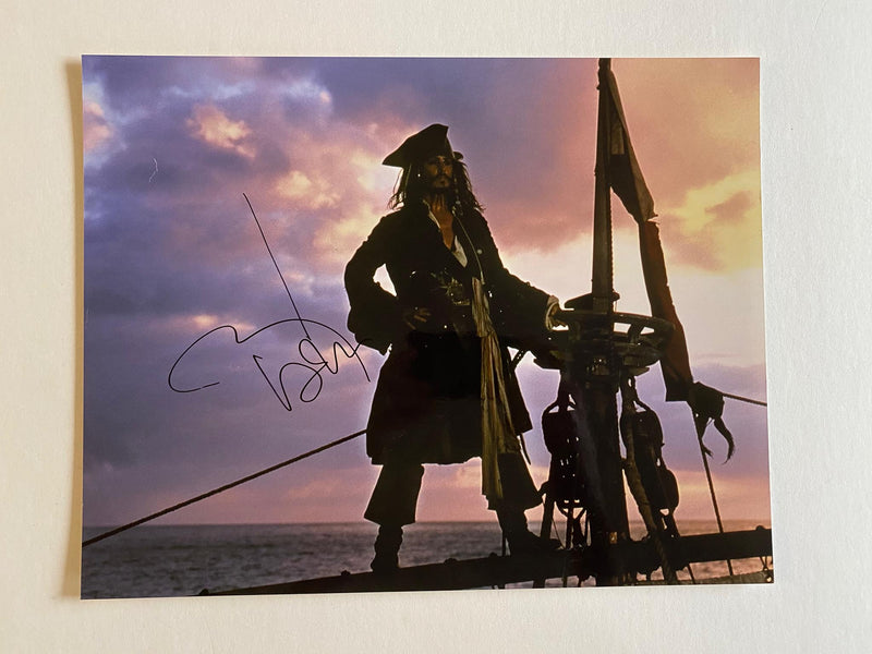 JOHNNY DEPP autographed "Pirates of the Caribbean" 11x14 photo