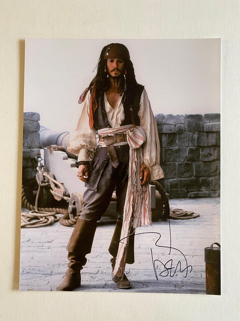 JOHNNY DEPP autographed "Pirates of the Caribean" 11x14 photo